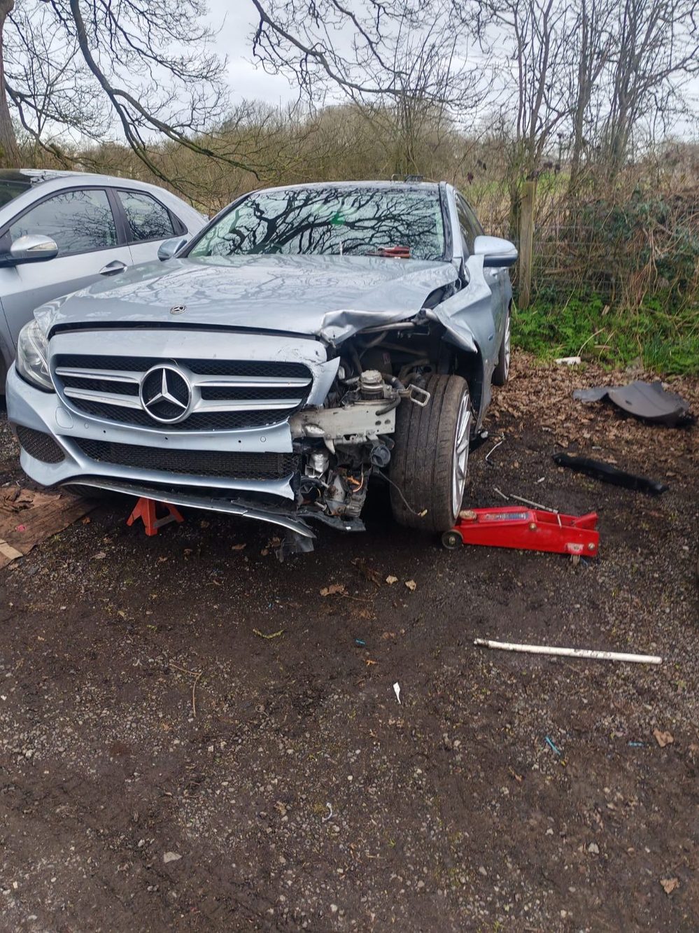 Mercedes-Benz C-Class with severe nearside front collision damage before repair at Wiluc Motors