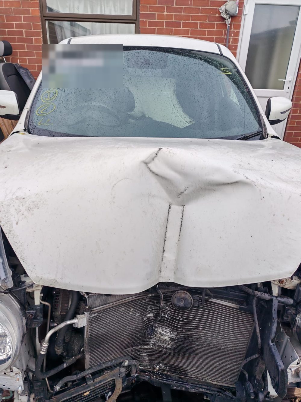 Nissan Juke with front-end collision damage before repair at Wiluc Motors