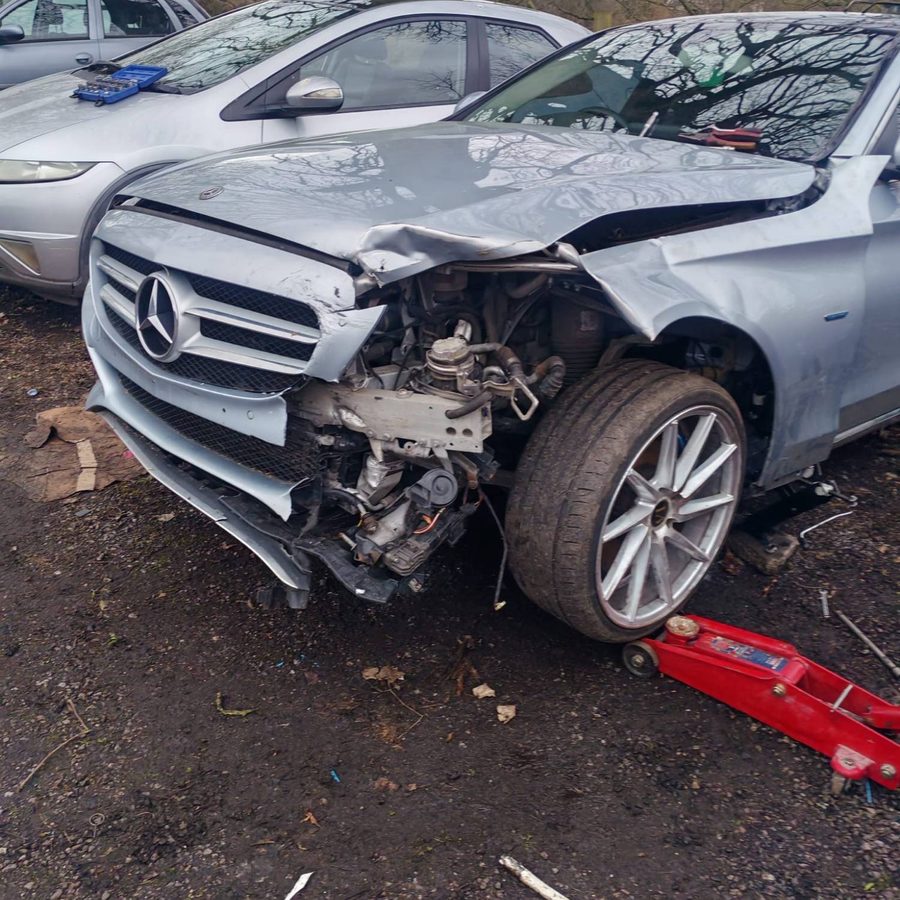 Stripping the Mercedes front end back to assess the full extent of the damage